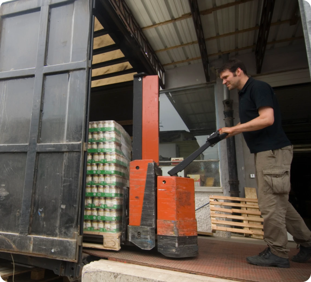 man loading beverages onto truck