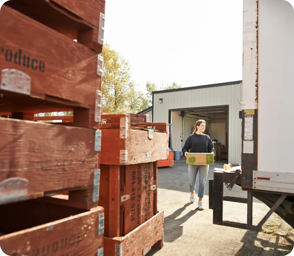 produce being loaded onto pallets for shipping