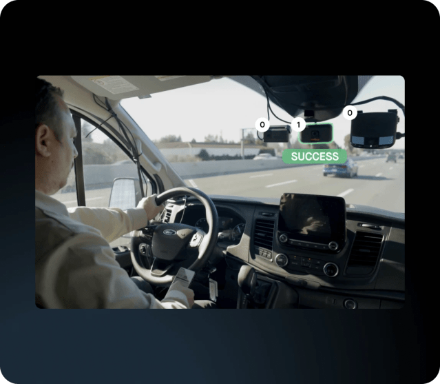 Driver monitored by Motive AI dashcam on the road.