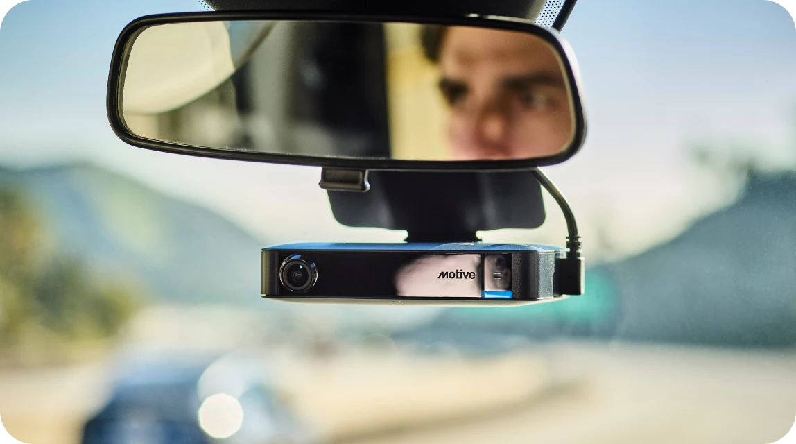 ai dashcam plus attached to windshield with driver image in rearview mirror
