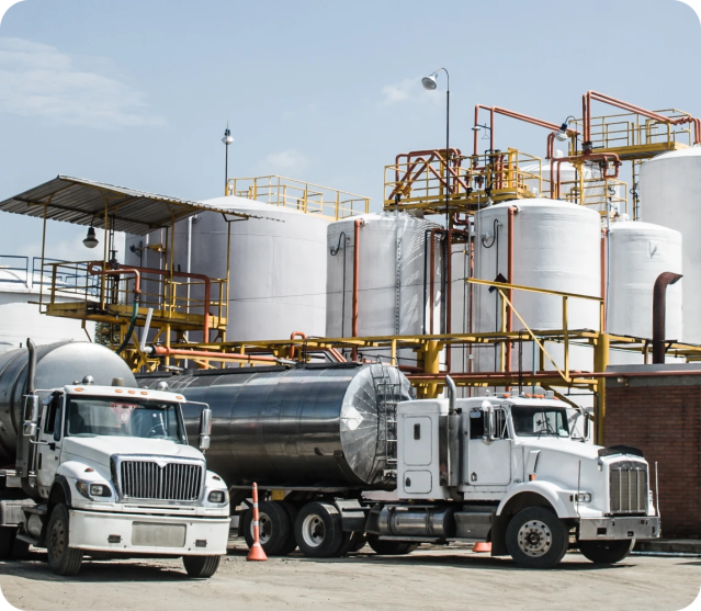 oil and gas trucks parked at refinery