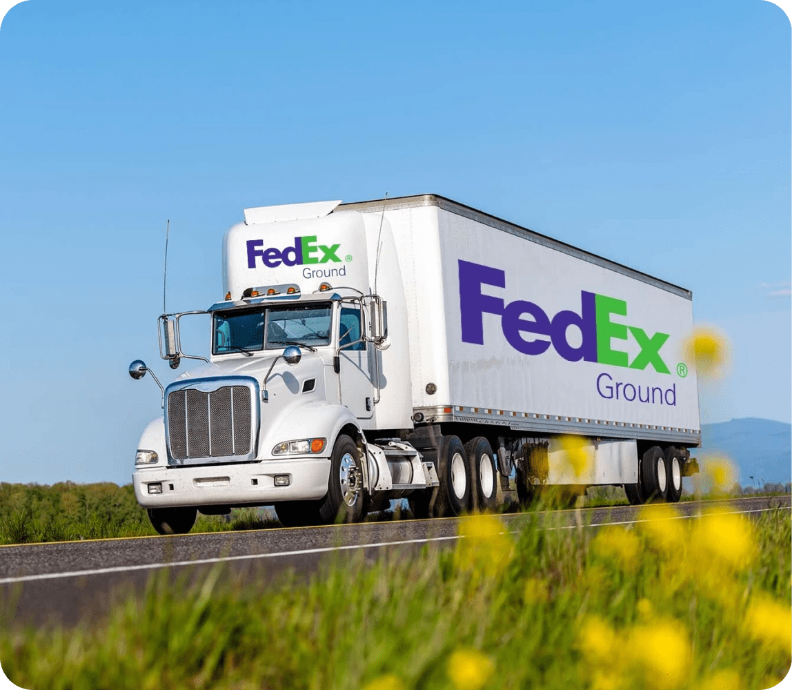 FedEx Ground semi-truck driving on a highway