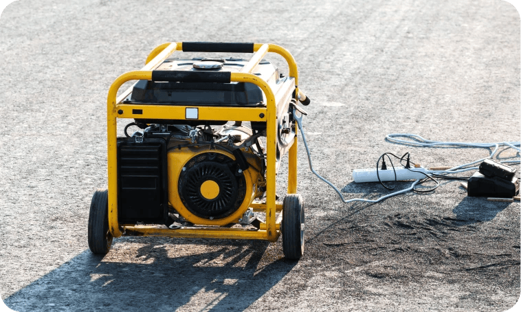 portable generator on pavement with cables attached