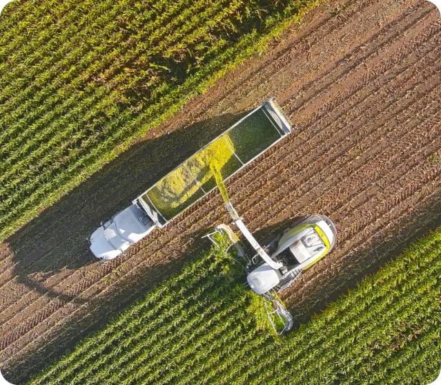 aerial view of agriculture vehicle and machine in field