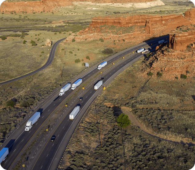 aerial view of freight trucks on a highway